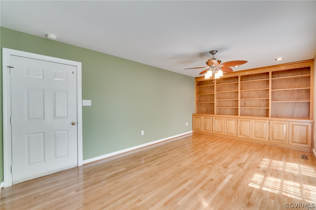 7512 Tangle Ridge Drive Mechanicsville, VA 23111 - Photo 9 of 23 a view of a room with wooden floor and windows