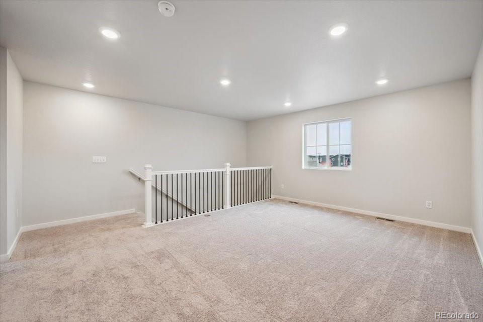 1382 Farmstead Street Brighton, CO 80601 - Photo 13 of 22 a view of an empty room with a window
