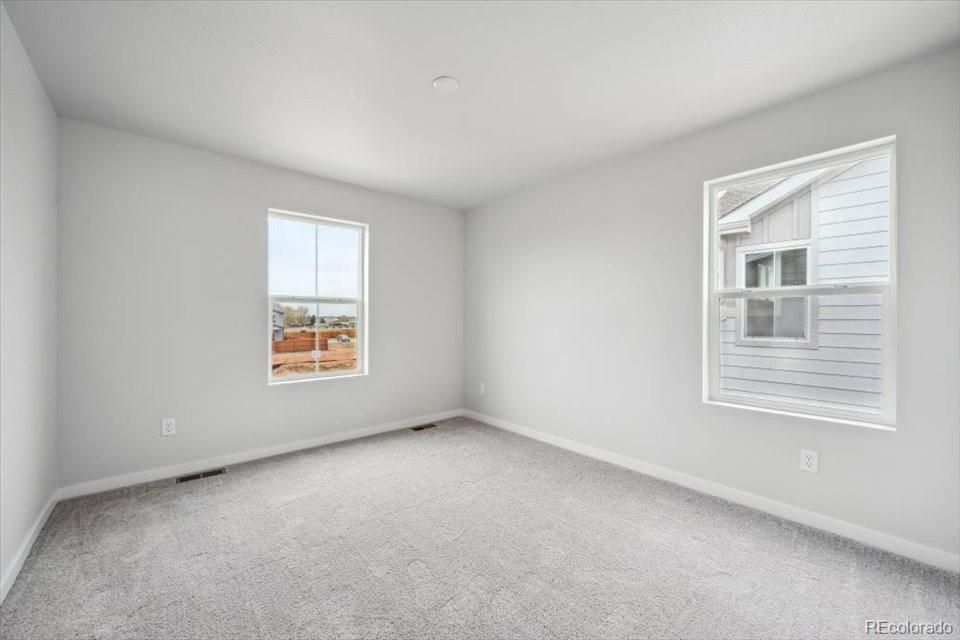 1382 Farmstead Street Brighton, CO 80601 - Photo 19 of 22 an empty room with a window