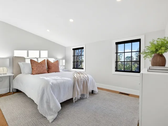 a bathroom with a shower a toilet and sink