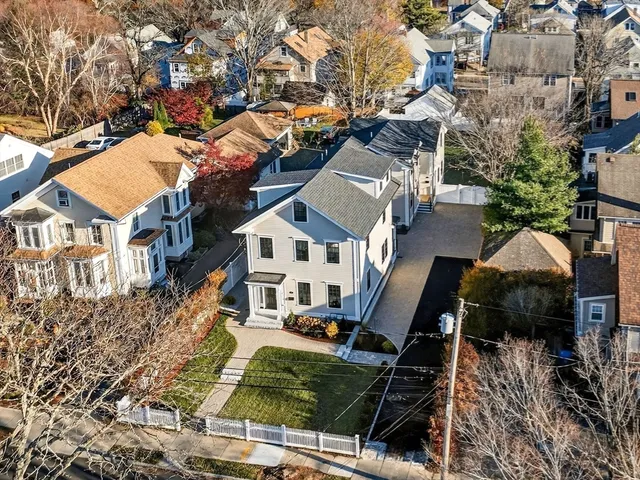 an aerial view of houses with outdoor space
