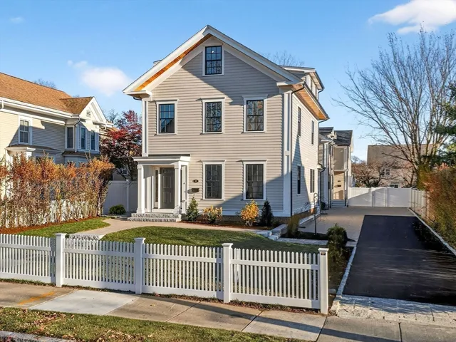 a large kitchen with kitchen island a large island in the center