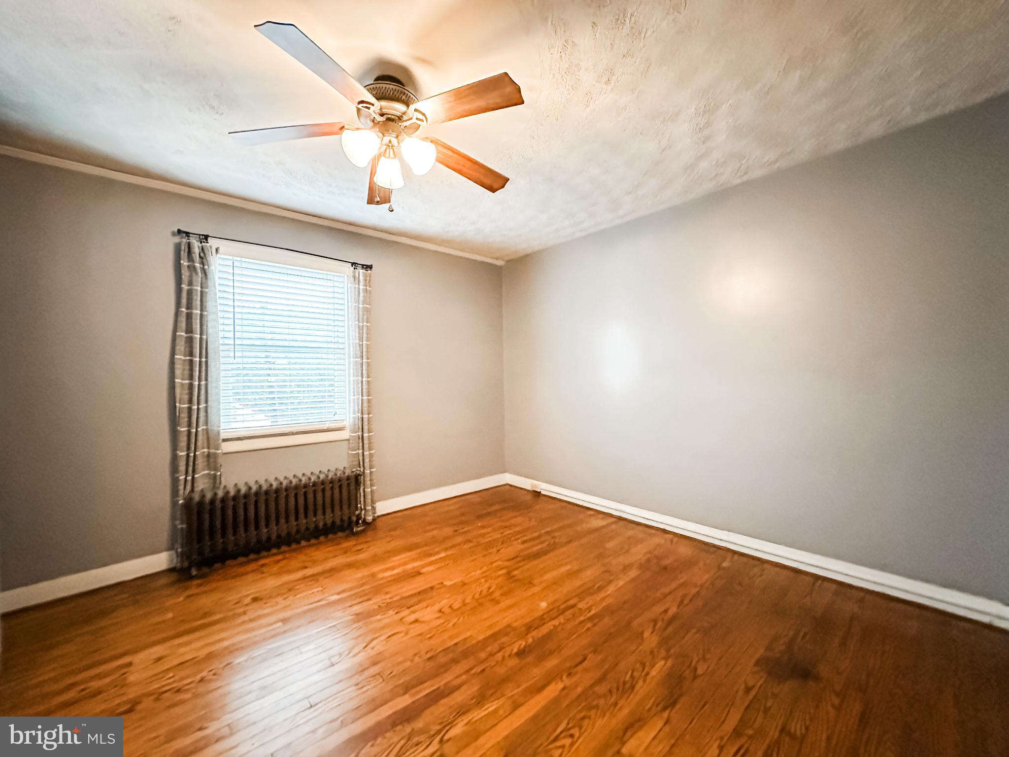 12812 New Row Rd N West Mount Savage, MD 21545 - Photo 20 of 32 wooden floor in an empty room with a window