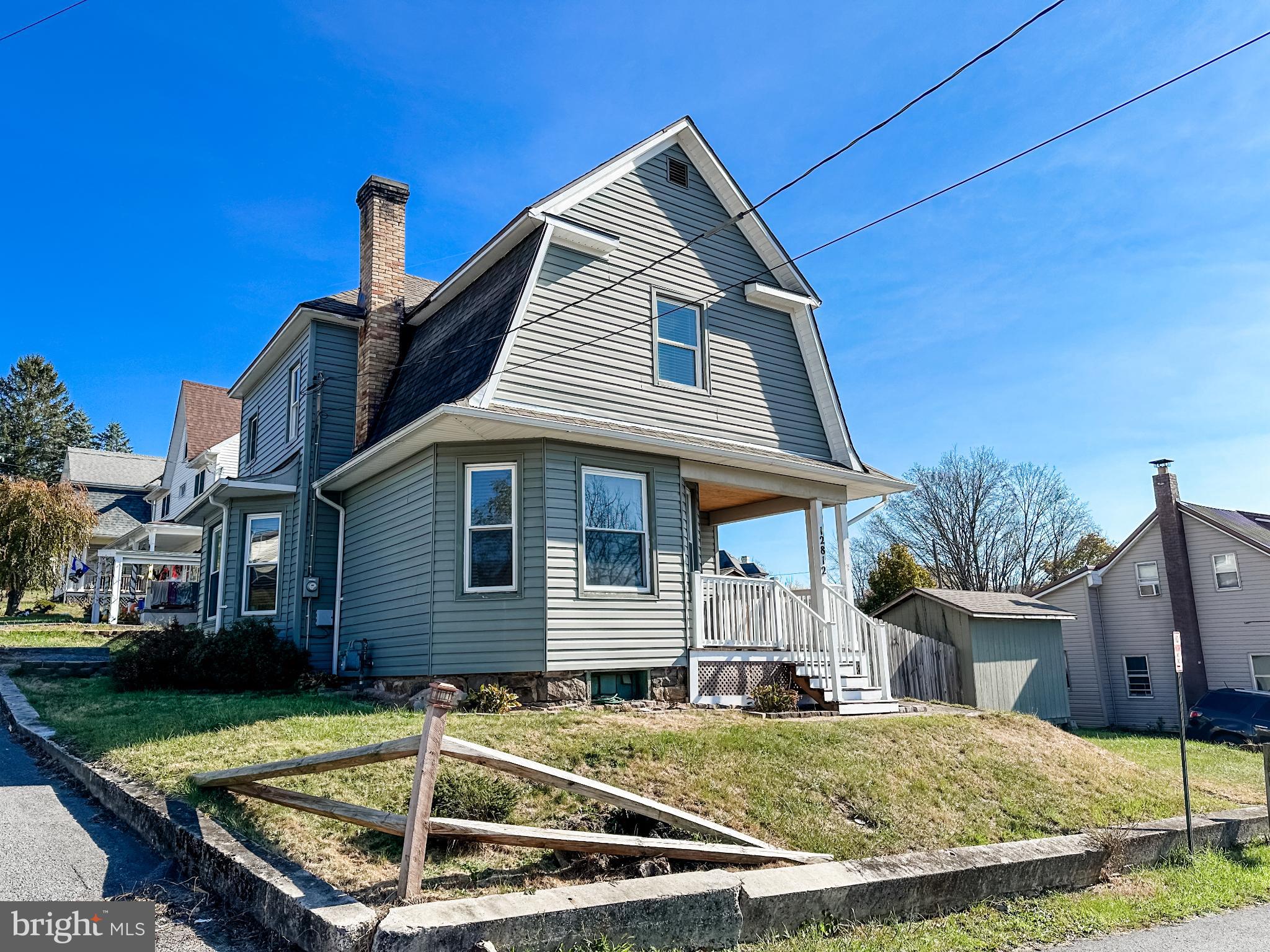 12812 New Row Rd N West Mount Savage, MD 21545 - Photo 2 of 32 a front view of a house with garden