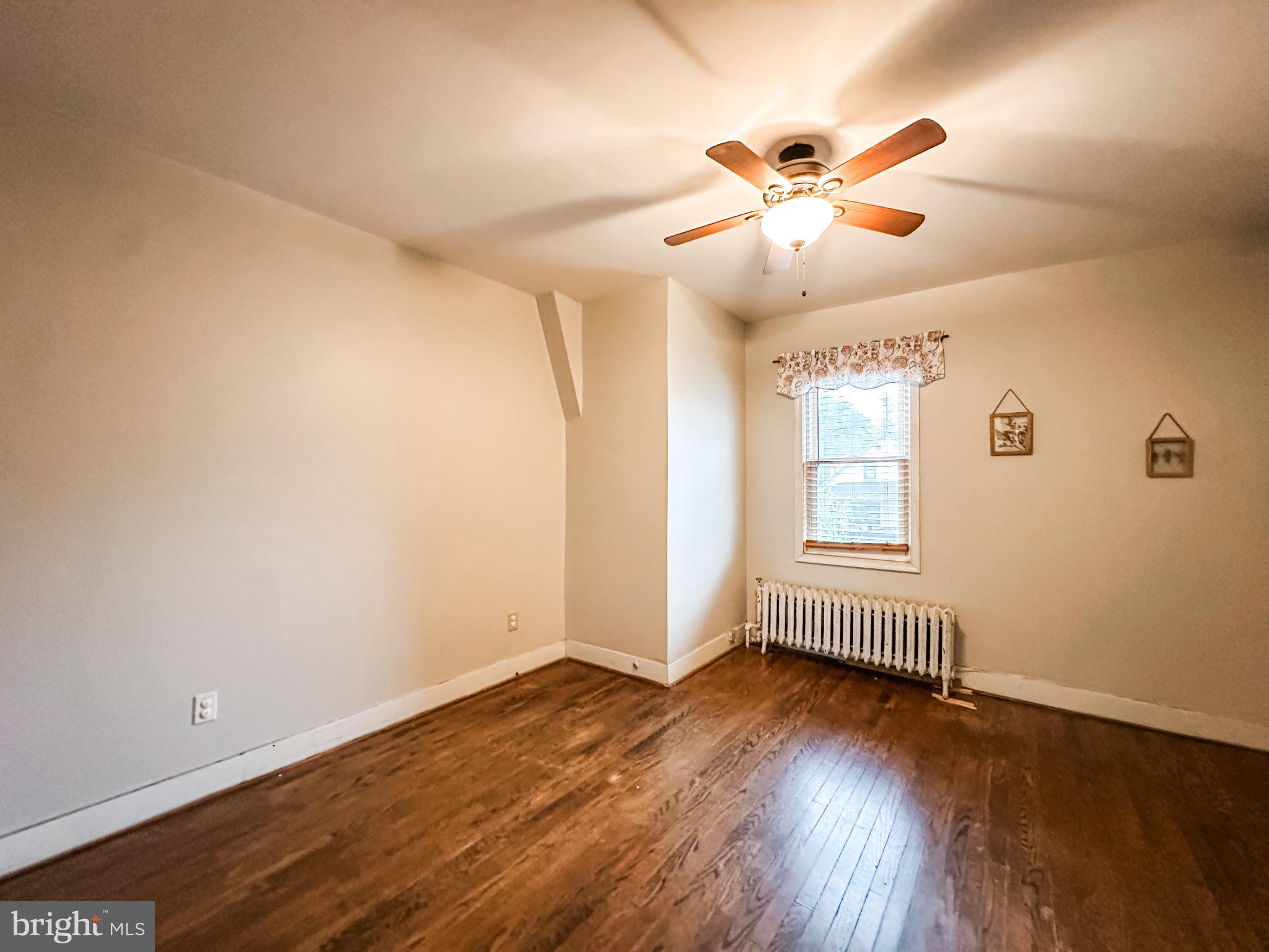 12812 New Row Rd N West Mount Savage, MD 21545 - Photo 23 of 32 wooden floor in an empty room with a window