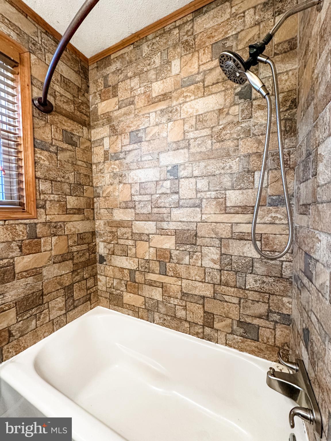 12812 New Row Rd N West Mount Savage, MD 21545 - Photo 28 of 32 a bathroom with a bathtub and shower