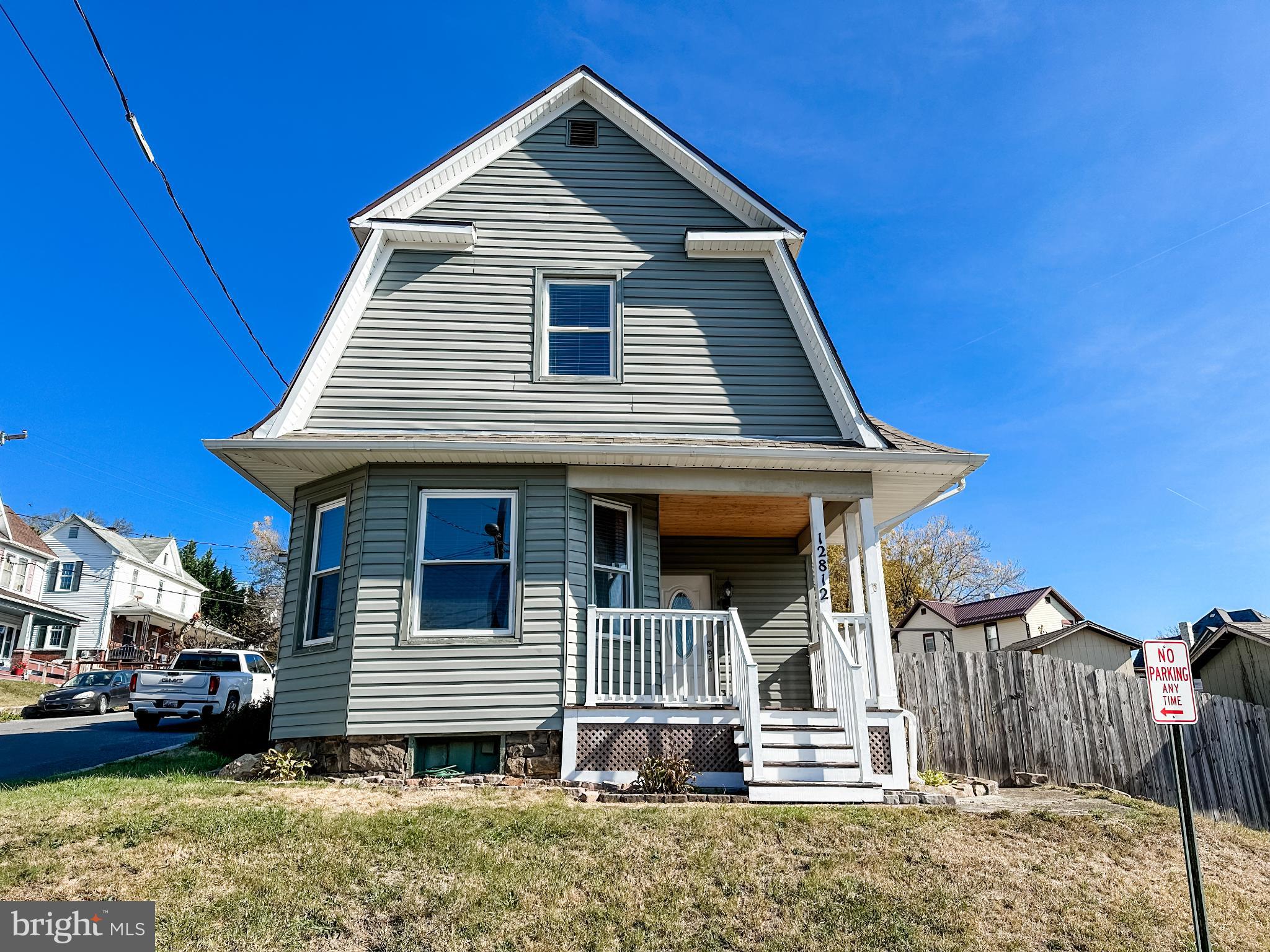 12812 New Row Rd N West Mount Savage, MD 21545 - Photo 3 of 32 a front view of a house with a yard