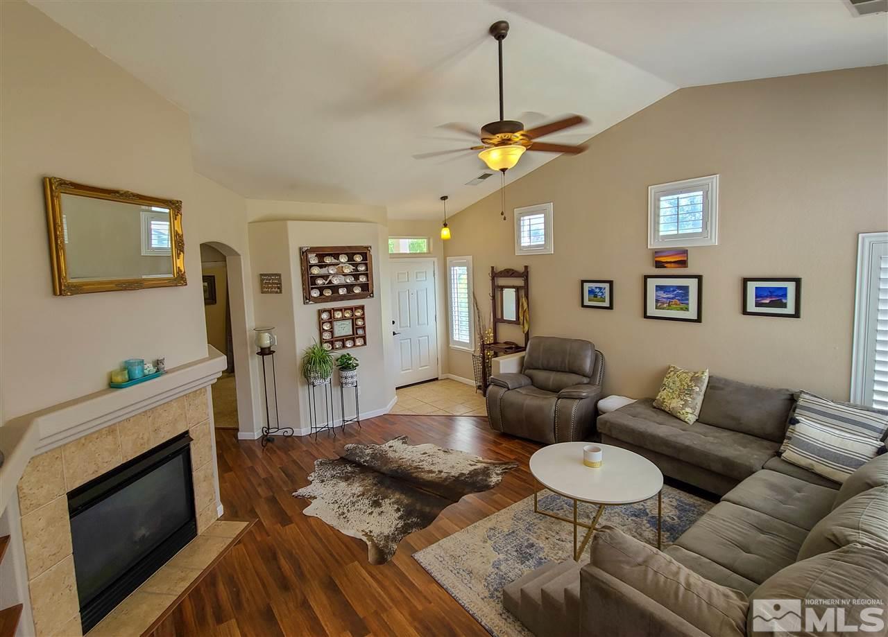 1736 River Gorge Court Reno, NV 89521 - Photo 4 of 23 a living room with furniture and a fireplace