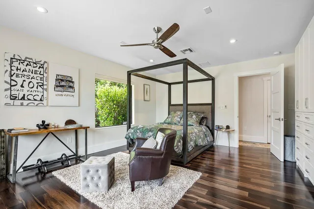 a bed room with furniture and a window