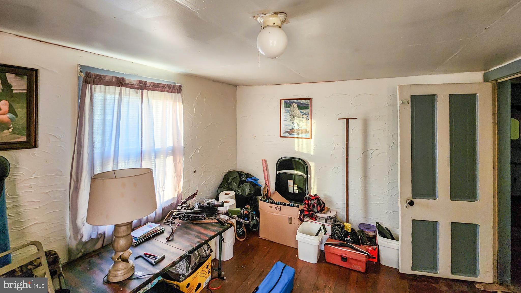 13614 Oldtown Road Southeast Cumberland, MD 21502 - Photo 12 of 30 a view of a workspace with furniture and a window