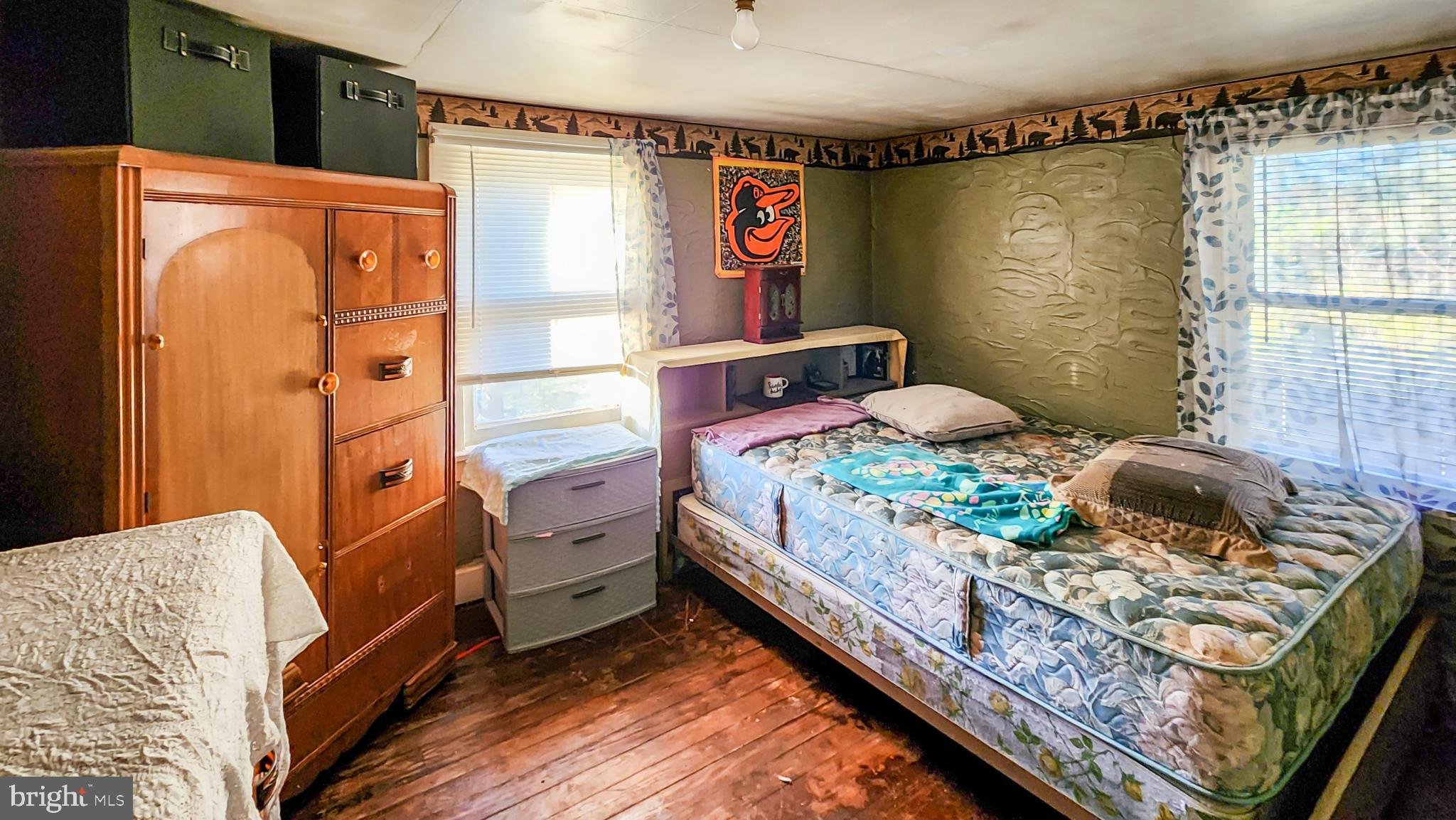 13614 Oldtown Road Southeast Cumberland, MD 21502 - Photo 13 of 30 a bedroom with a bed and a dresser
