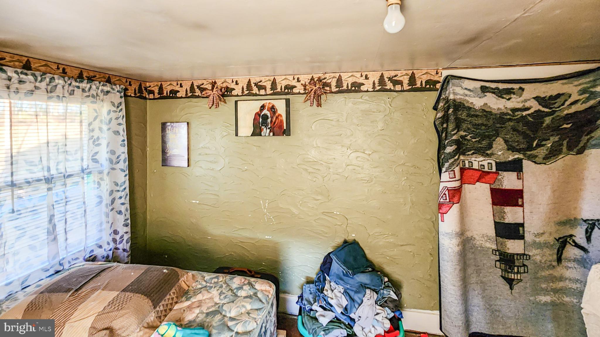 13614 Oldtown Road Southeast Cumberland, MD 21502 - Photo 14 of 30 a bedroom with a bed and a walk in closet