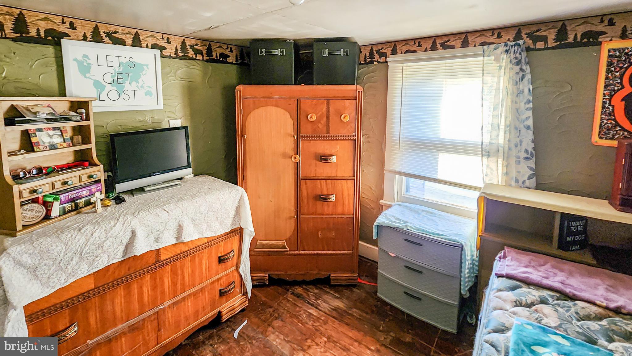 13614 Oldtown Road Southeast Cumberland, MD 21502 - Photo 15 of 30 a bedroom with a bed and a window