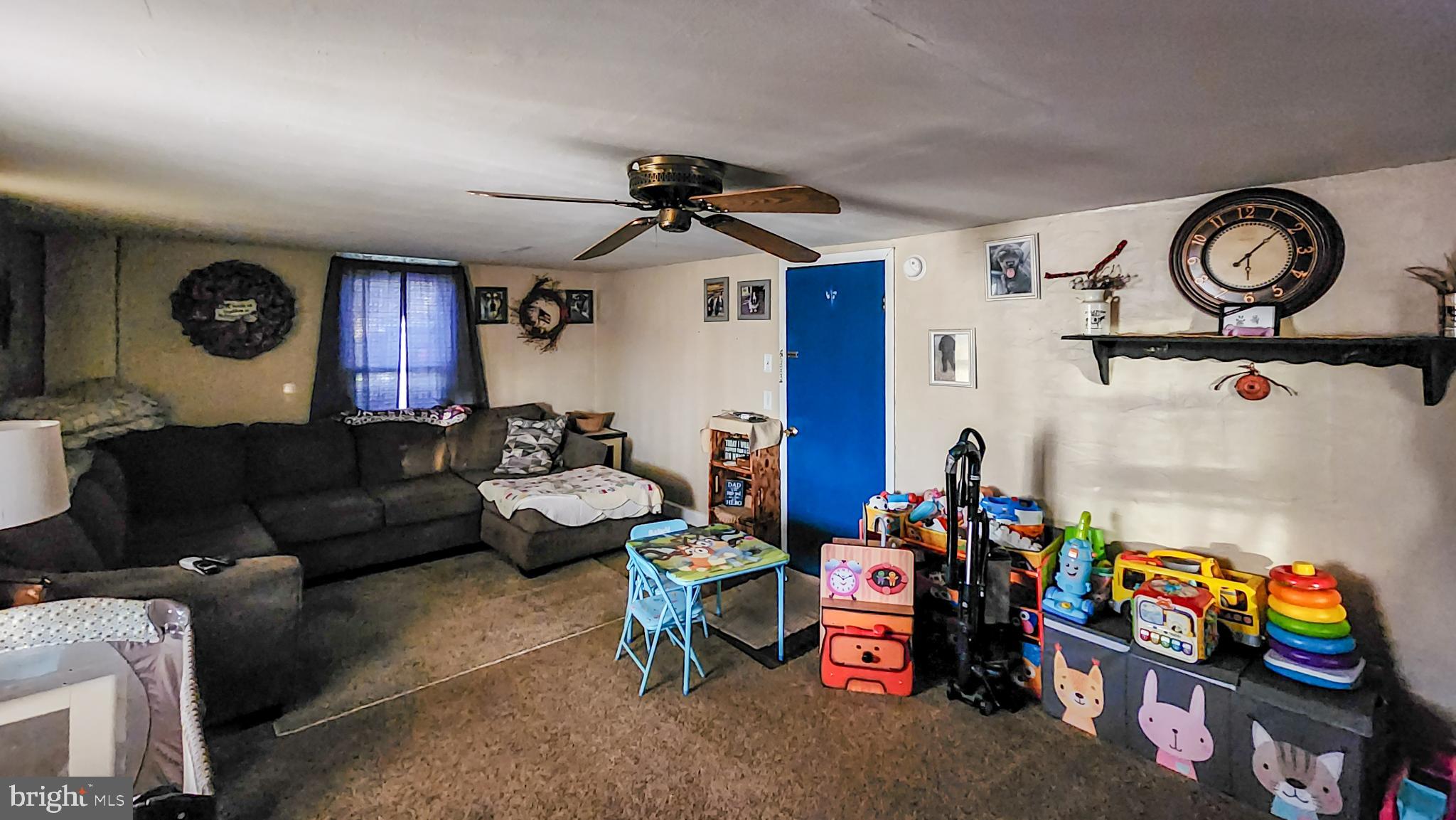 13614 Oldtown Road Southeast Cumberland, MD 21502 - Photo 4 of 30 a living room with lots of furniture and a fan