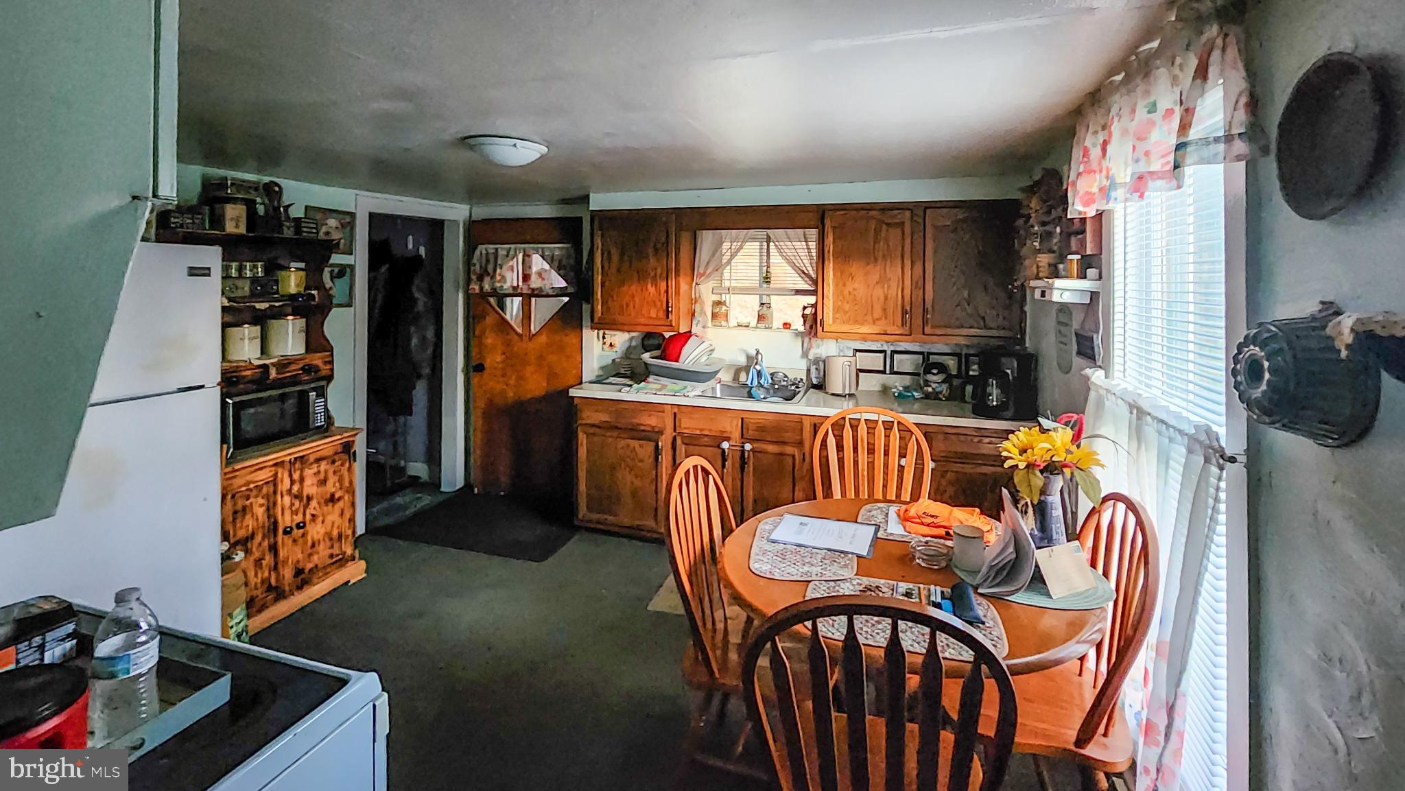 13614 Oldtown Road Southeast Cumberland, MD 21502 - Photo 6 of 30 a view of a kitchen and dining room