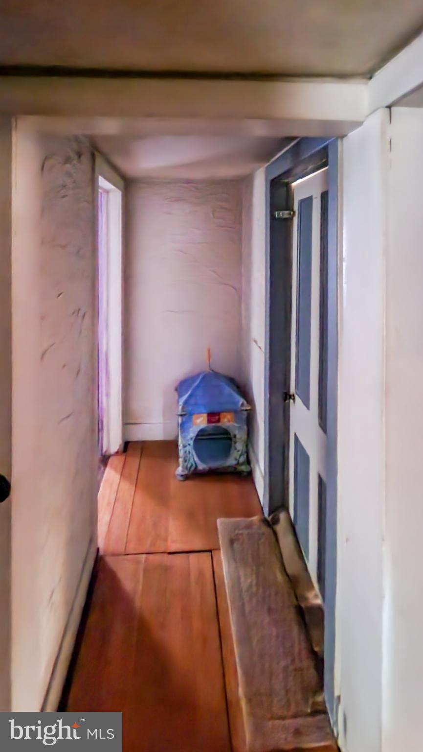 13614 Oldtown Road Southeast Cumberland, MD 21502 - Photo 9 of 30 a hallway with a large window and a potted plant