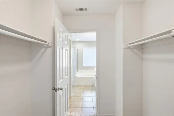 a bathroom with a bathtub shower sink vanity and toilet