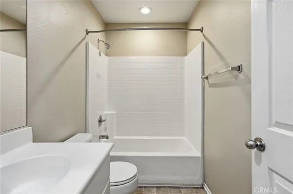 a spacious bathroom with sinks mirror and a bathtub