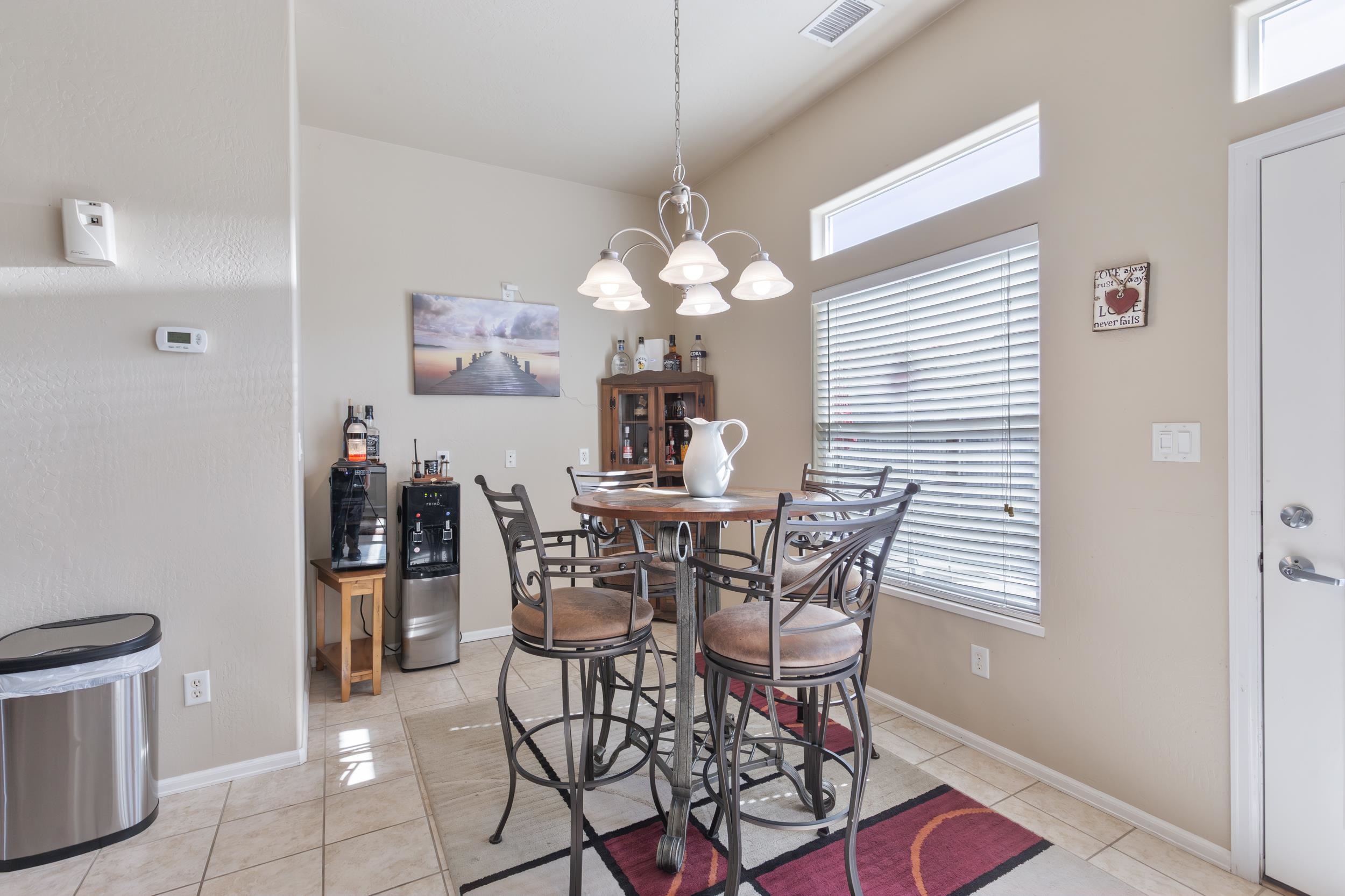 544 Hemlock Drive Fruita, CO 81521 - Photo 13 of 36 a view of a dining room with furniture and chandelier