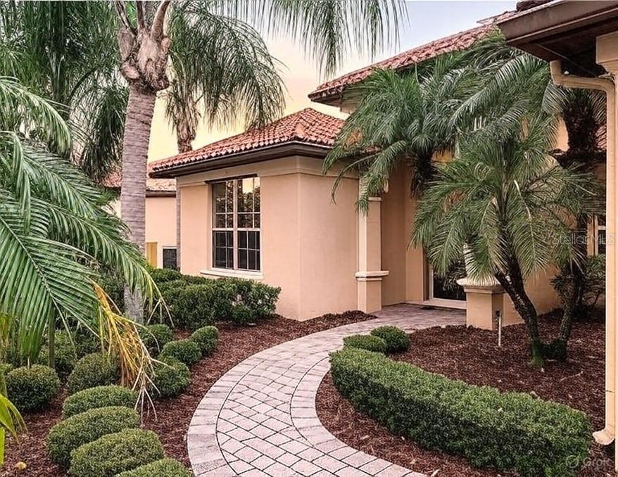 11660 Delwick Drive Windermere, FL 34786 - Photo 1 of 1 a front view of a house with a yard