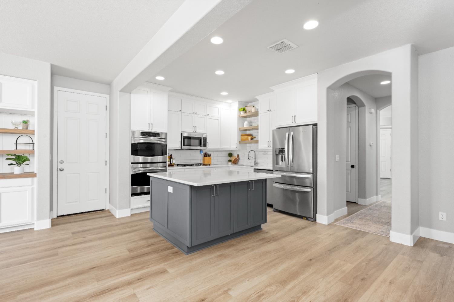 11749 Dionysus Way Rancho Cordova, CA 95742 - Photo 23 of 56 a kitchen with stainless steel appliances granite countertop a refrigerator and a sink