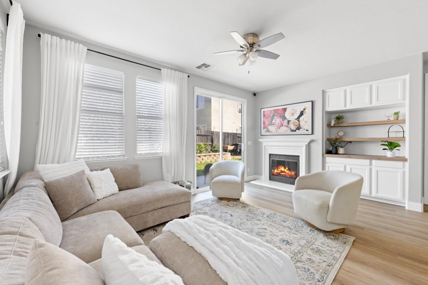 11749 Dionysus Way Rancho Cordova, CA 95742 - Photo 26 of 56 a living room with furniture and a fireplace