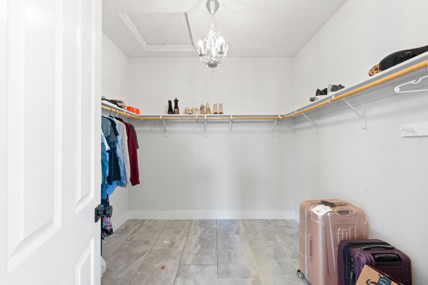 11749 Dionysus Way Rancho Cordova, CA 95742 - Photo 28 of 56 a view of walk in closet with clothes