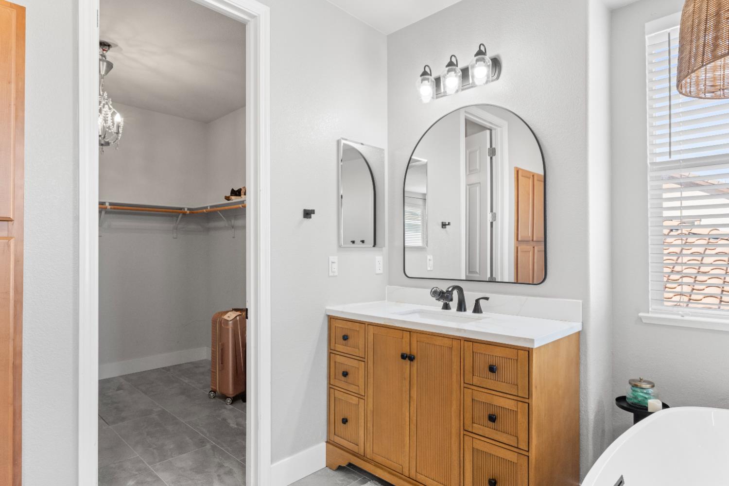 11749 Dionysus Way Rancho Cordova, CA 95742 - Photo 29 of 56 a bathroom with a double vanity sink and a mirror