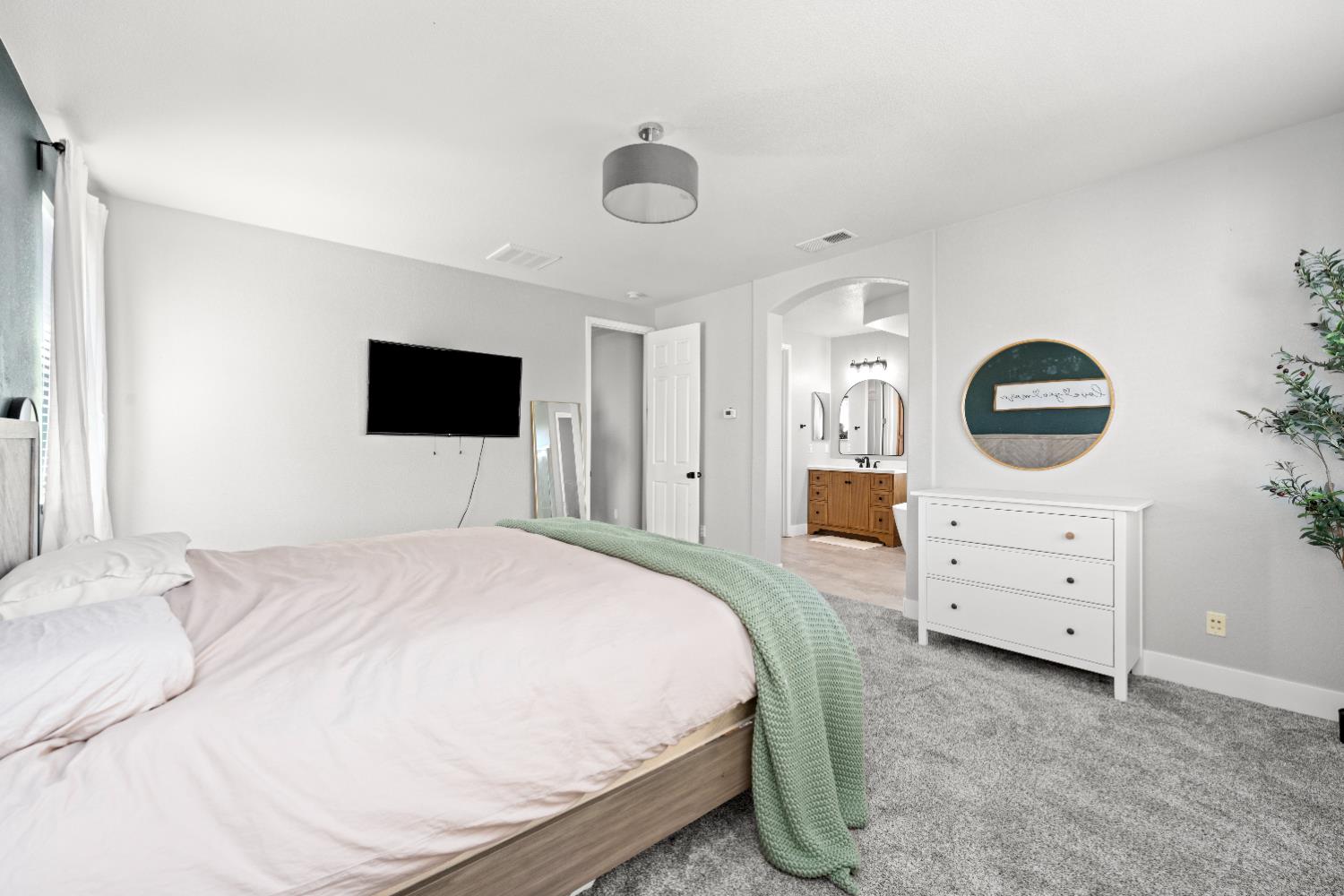 11749 Dionysus Way Rancho Cordova, CA 95742 - Photo 34 of 56 a bedroom with a bed and a dresser