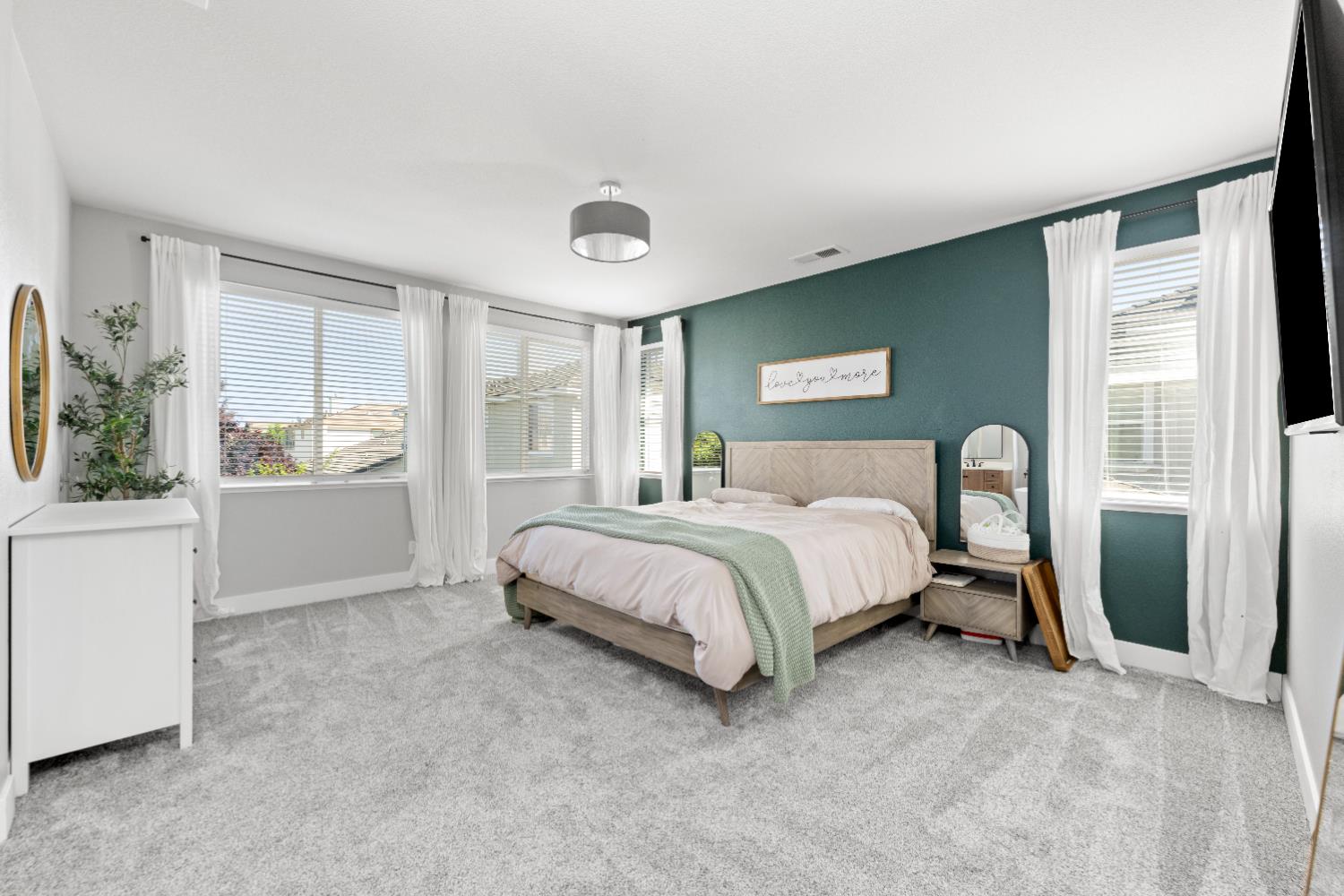 11749 Dionysus Way Rancho Cordova, CA 95742 - Photo 36 of 56 a bedroom with a large bed and a window