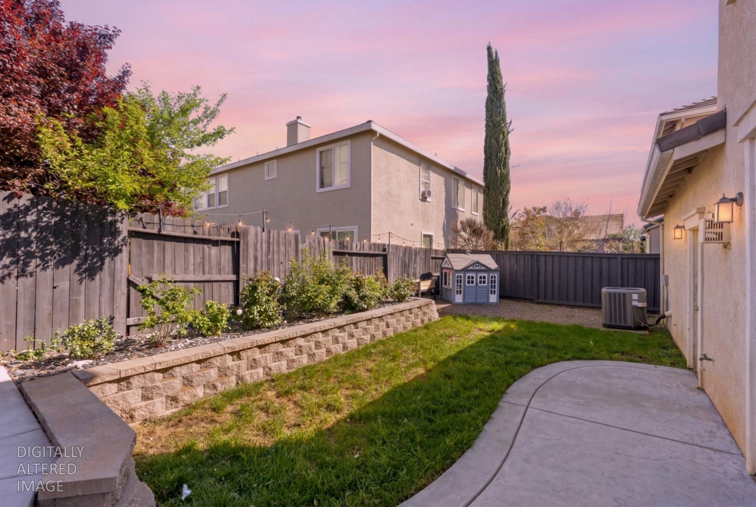 11749 Dionysus Way Rancho Cordova, CA 95742 - Photo 53 of 56 a front view of a house with garden