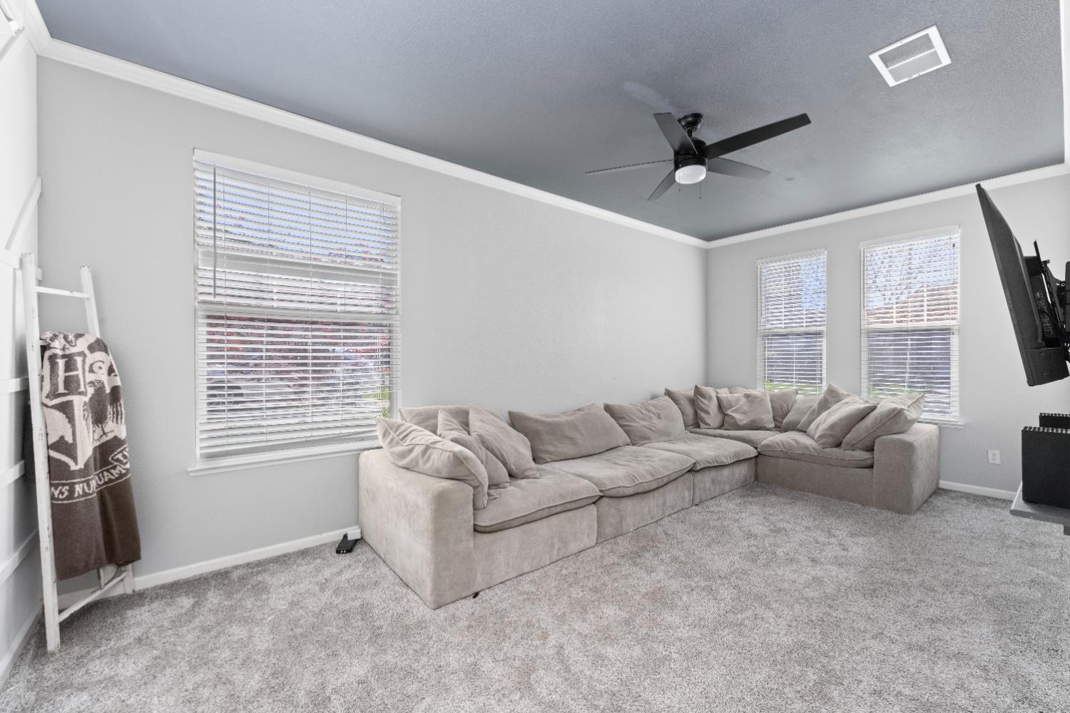 11749 Dionysus Way Rancho Cordova, CA 95742 - Photo 7 of 56 a living room with furniture and a large window