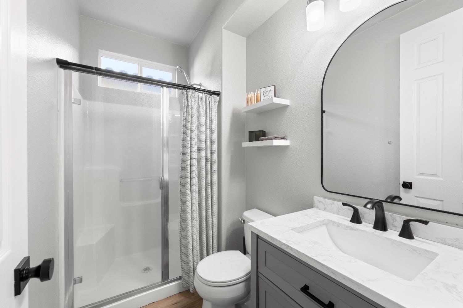 11749 Dionysus Way Rancho Cordova, CA 95742 - Photo 8 of 56 a bathroom with a sink toilet and shower