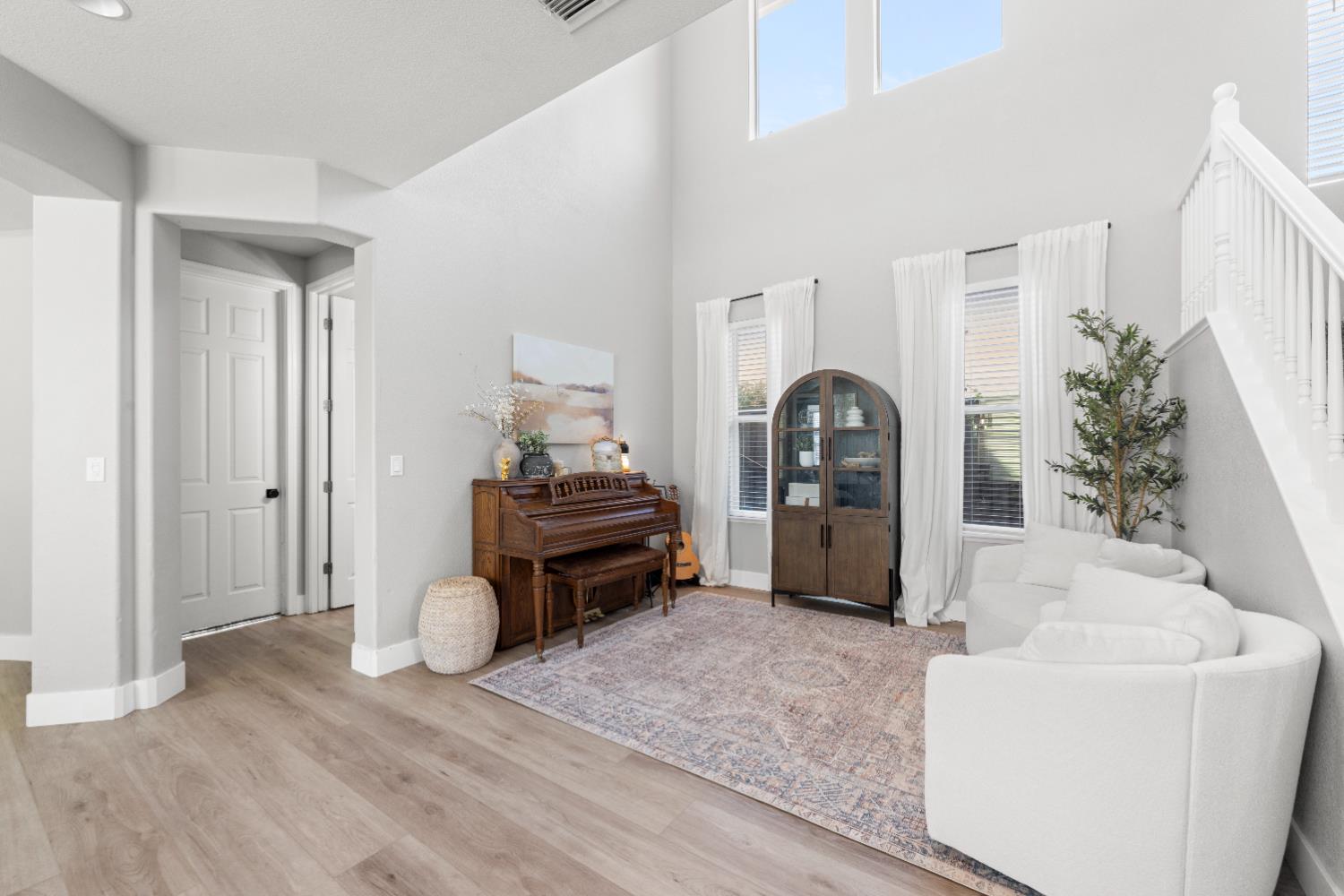 11749 Dionysus Way Rancho Cordova, CA 95742 - Photo 9 of 56 a living room with furniture and wooden floor
