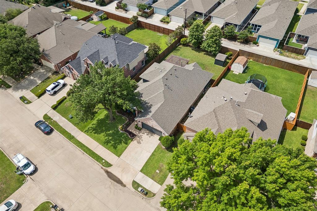 9217 Inverness Drive Rowlett, TX 75089 - Photo 30 of 40 Aerial View of the Property — From above, you can see the home’s established setting, mature trees, and generous lot layout within the Waterview neighborhood.