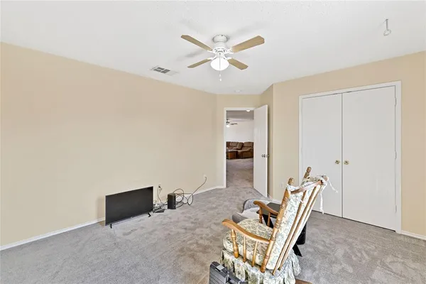 a work room with furniture and rug