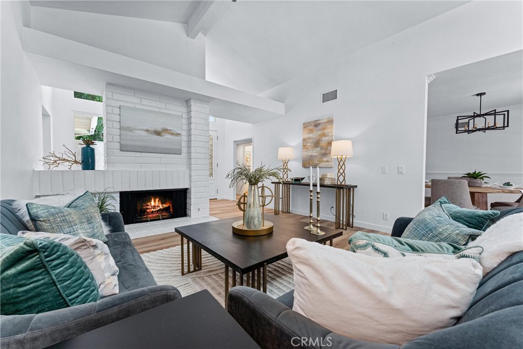 29 Bethany Drive Irvine, CA 92603 - Photo 1 of 44 a living room with furniture and a fireplace