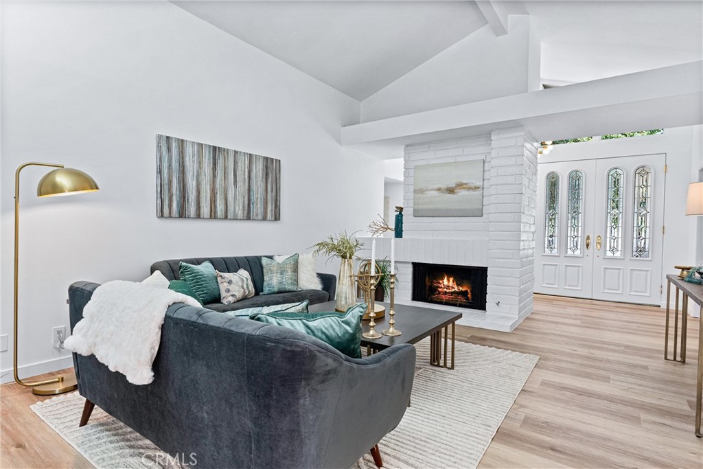 29 Bethany Drive Irvine, CA 92603 - Photo 14 of 44 a living room with furniture and a fireplace