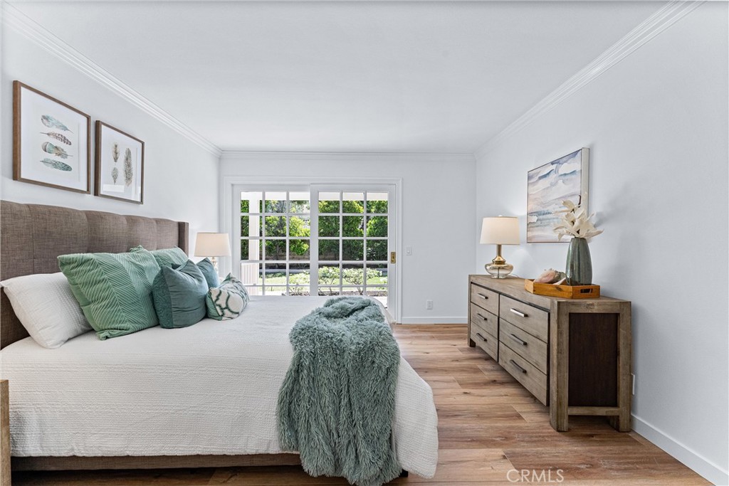 29 Bethany Drive Irvine, CA 92603 - Photo 19 of 44 a spacious bedroom with a bed and wooden floor