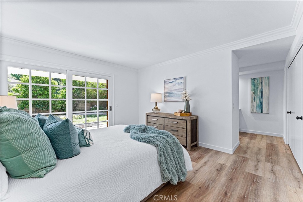 29 Bethany Drive Irvine, CA 92603 - Photo 25 of 44 a bedroom with a bed and wooden floor