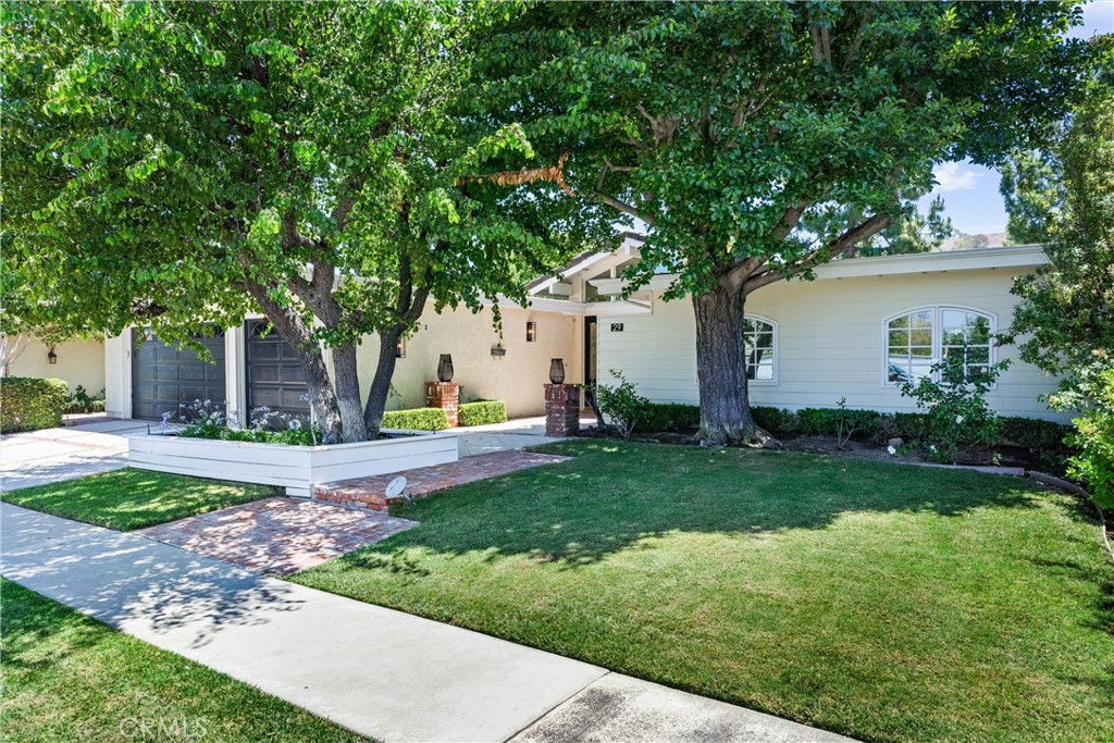 29 Bethany Drive Irvine, CA 92603 - Photo 3 of 44 a front view of house with yard and green space
