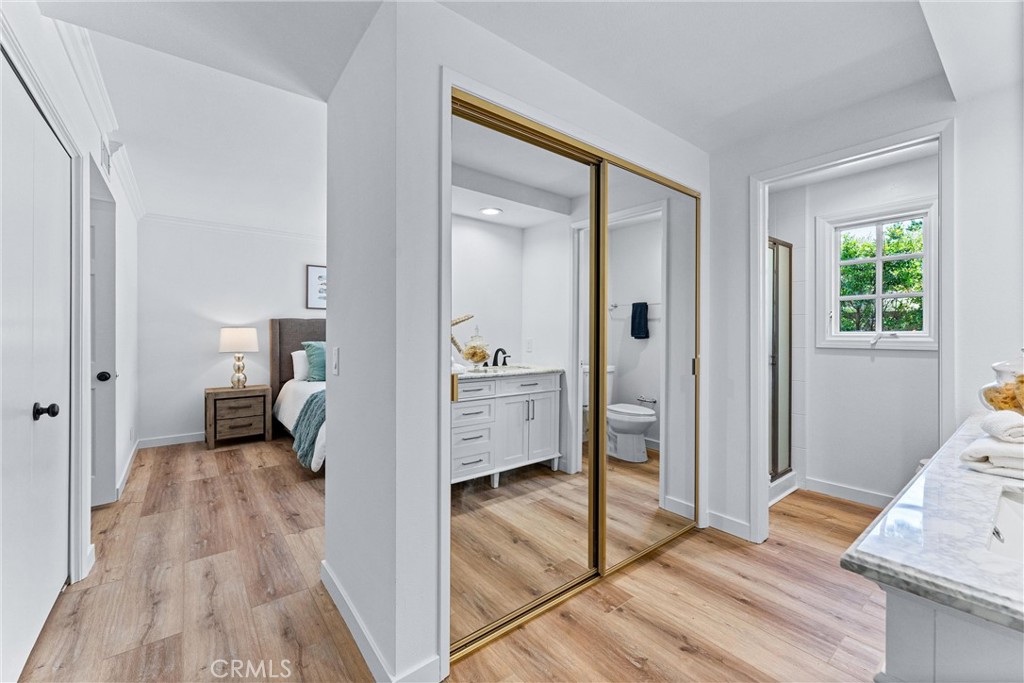 29 Bethany Drive Irvine, CA 92603 - Photo 31 of 44 a en suite bathroom with a sink and a mirror