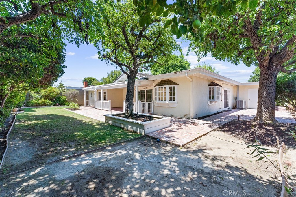 29 Bethany Drive Irvine, CA 92603 - Photo 34 of 44 a white house that has a tree in front of it