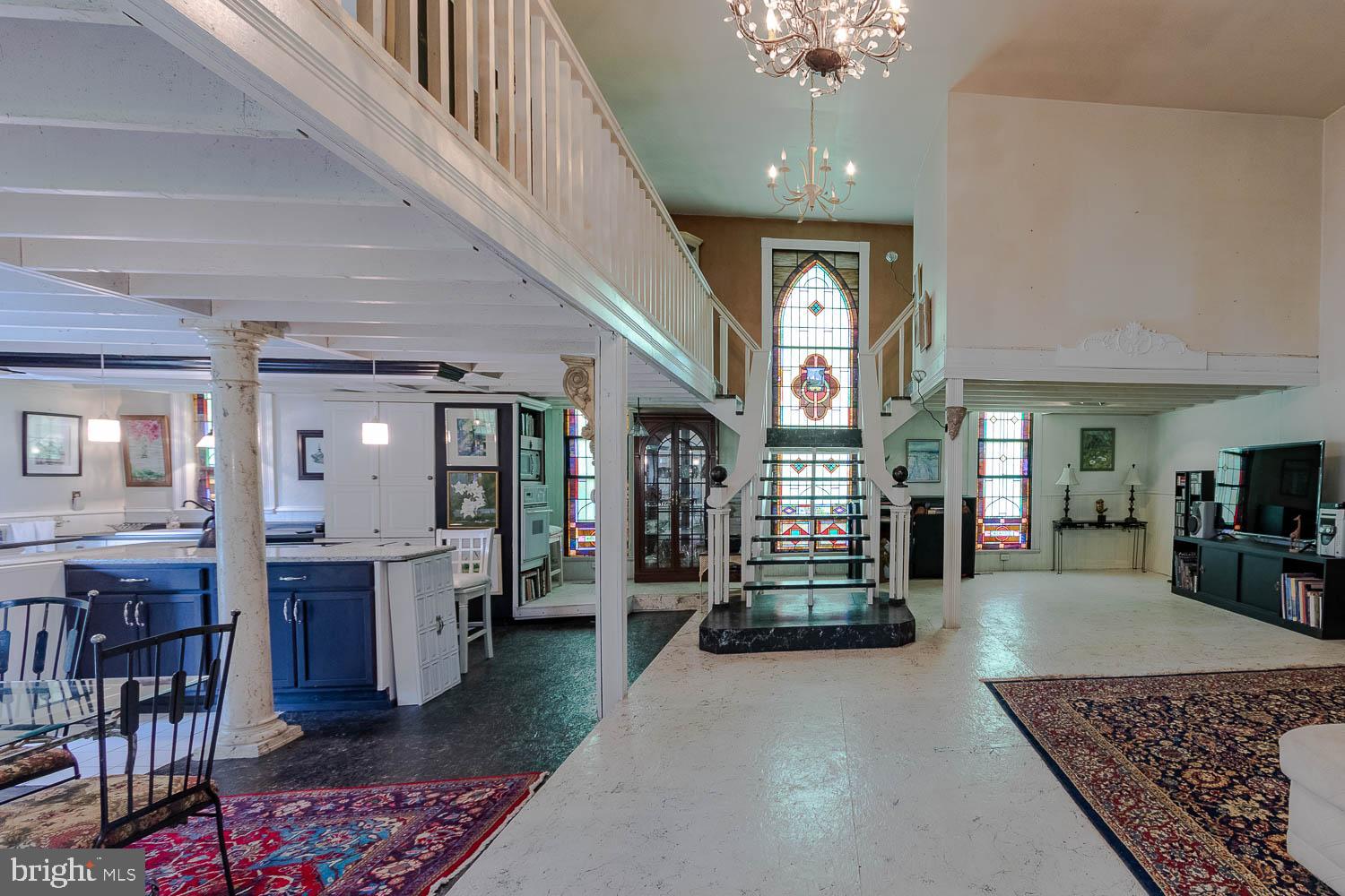 125 Colorado Road Munson, PA 16860 - Photo 14 of 43 a living room with furniture and a chandelier