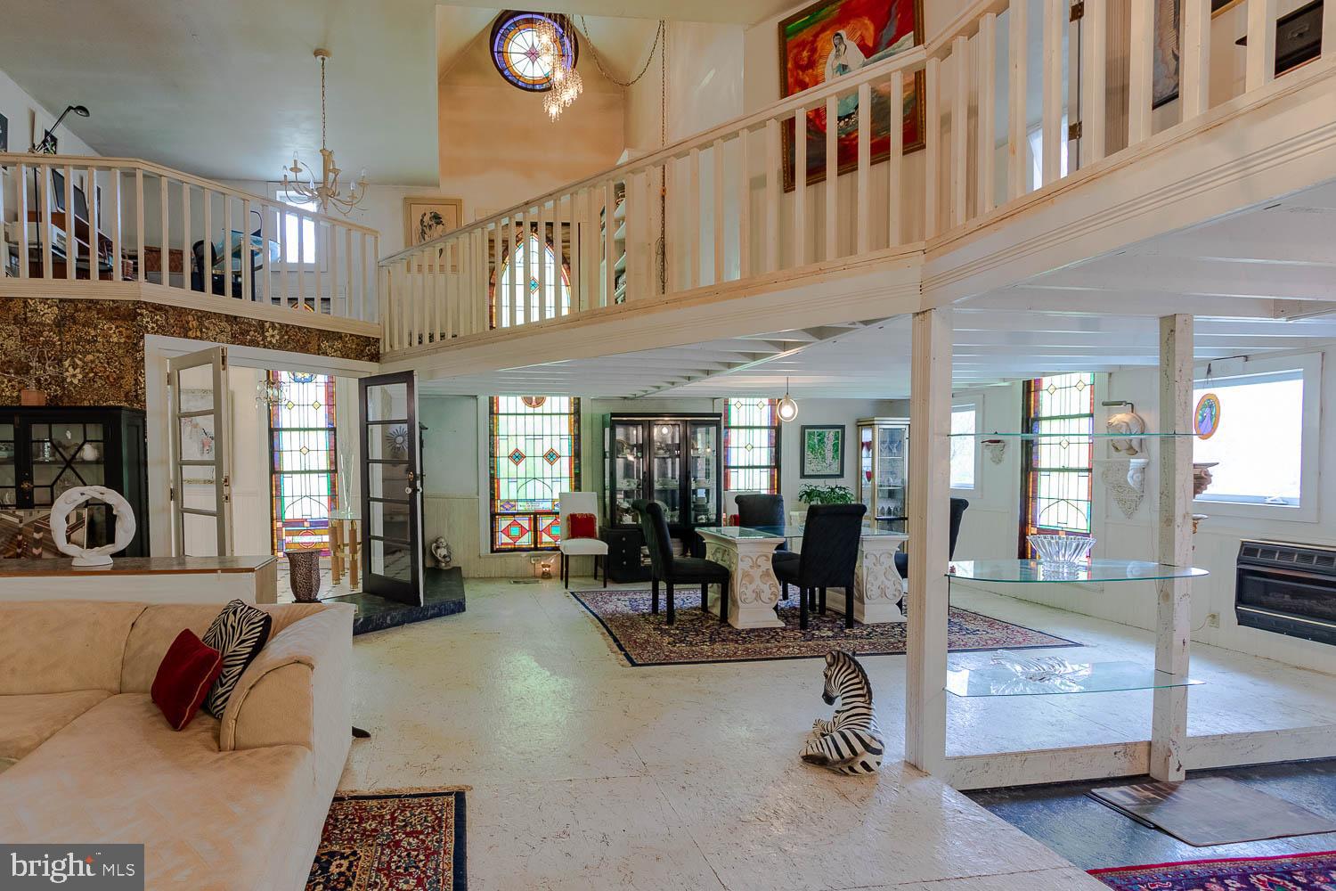125 Colorado Road Munson, PA 16860 - Photo 17 of 43 a living room with furniture gym equipment and a large window