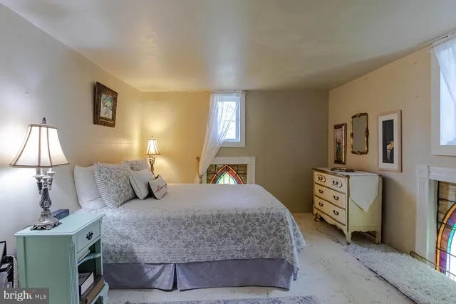 a bedroom with a bed and a dresser