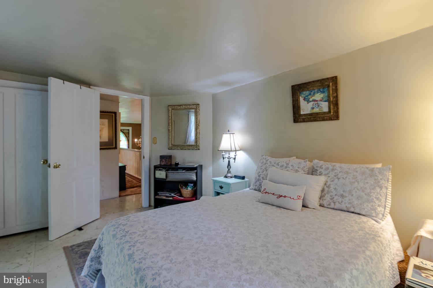 125 Colorado Road Munson, PA 16860 - Photo 36 of 43 a bedroom with a bed and a refrigerator