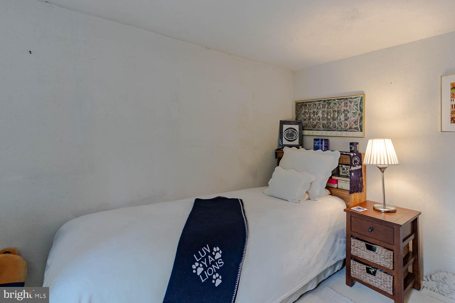 125 Colorado Road Munson, PA 16860 - Photo 37 of 43 a bed room with a bed and a lamp on desk