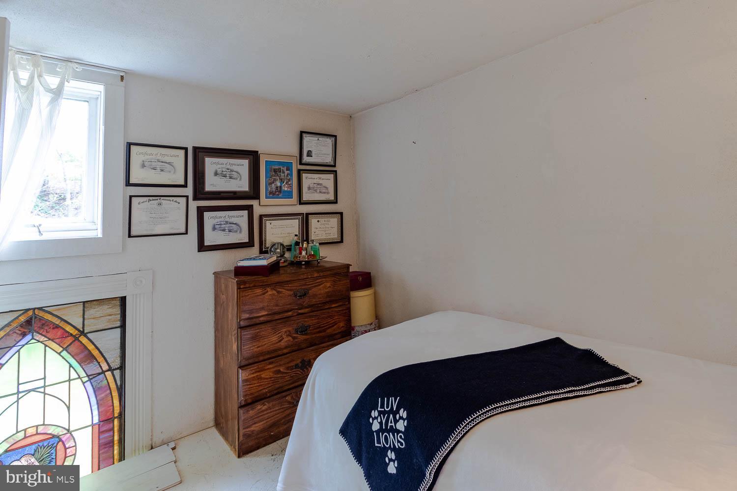 125 Colorado Road Munson, PA 16860 - Photo 38 of 43 a bedroom with a bed and a painting on the wall