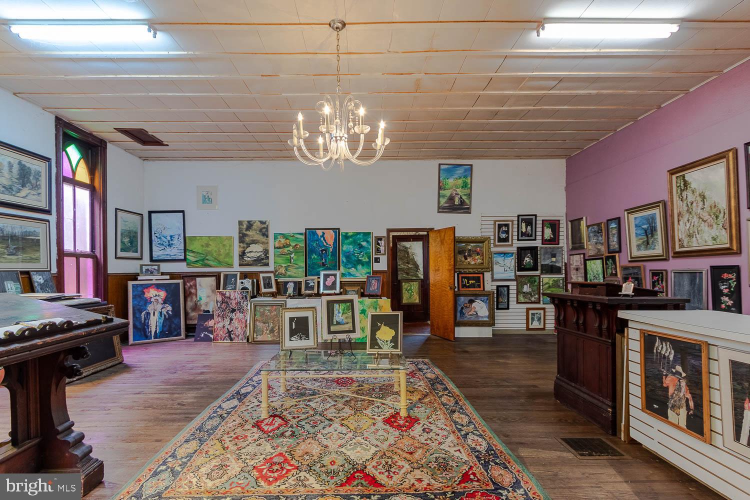 125 Colorado Road Munson, PA 16860 - Photo 40 of 43 a view of a dining room with furniture a rug and wooden floor